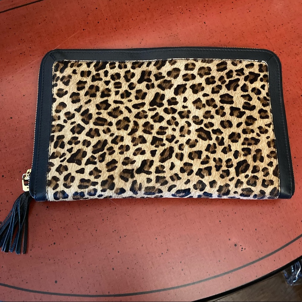 NWOT versatile, leather animal print clutch.
